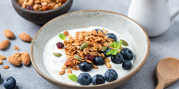 Image of a breakfast bowl with yogurt, granola, and blueberries